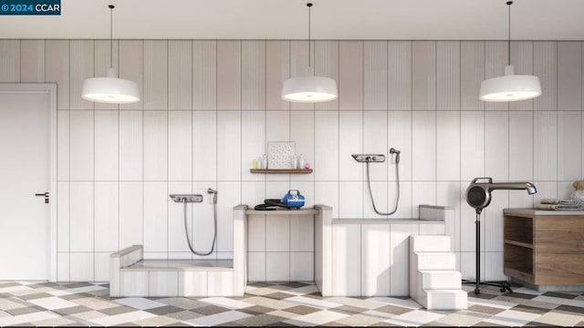 bathroom featuring tile walls and walk in shower