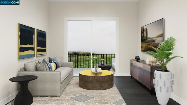 sitting room with wood-type flooring