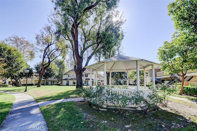 view of community featuring a gazebo and a yard