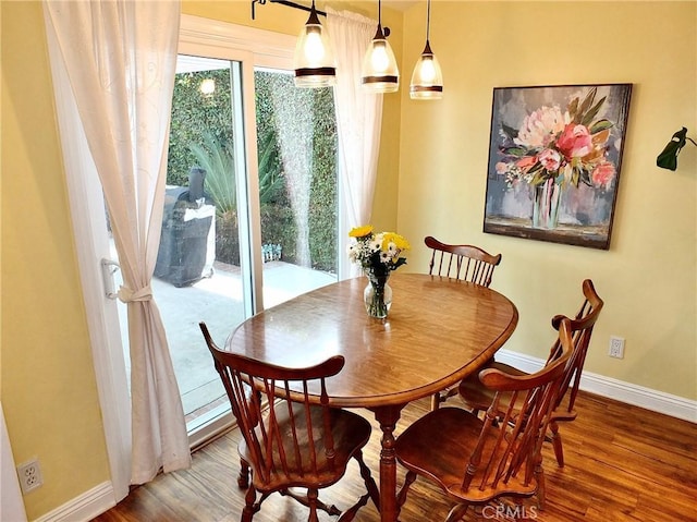 dining area with wood-type flooring