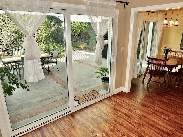 doorway to outside featuring hardwood / wood-style flooring