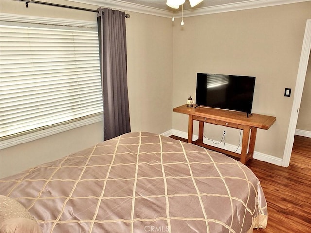 bedroom featuring hardwood / wood-style flooring and ornamental molding