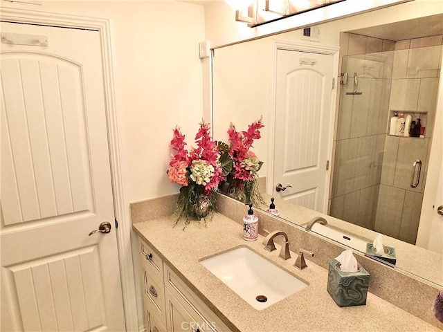 bathroom with vanity and an enclosed shower