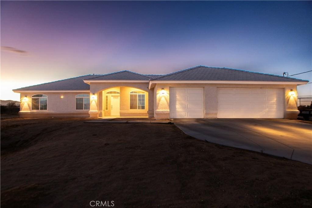 view of front of property with a garage