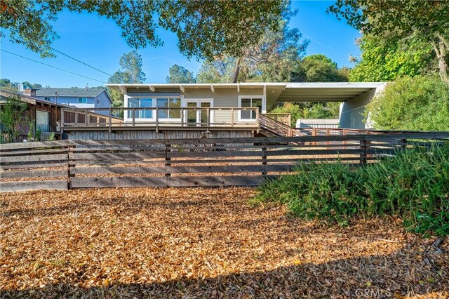 exterior space with a carport