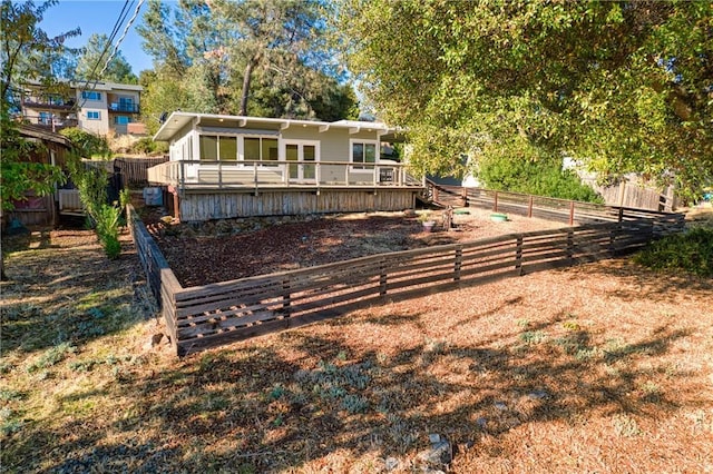 view of front of property featuring a wooden deck