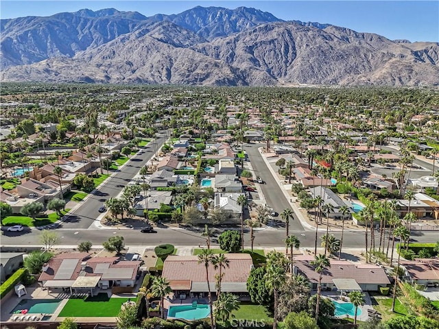 birds eye view of property featuring a mountain view