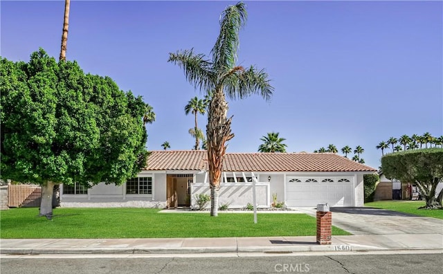 view of front facade featuring a garage and a front lawn