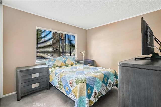 bedroom featuring carpet floors, a textured ceiling, and ornamental molding