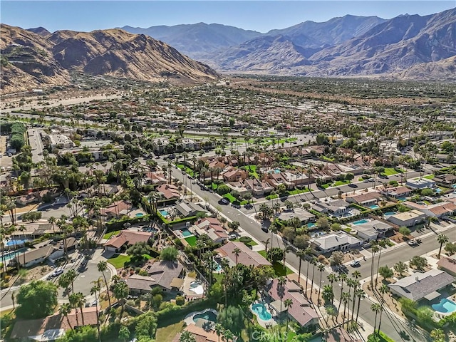 birds eye view of property featuring a mountain view