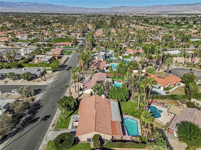 birds eye view of property featuring a mountain view