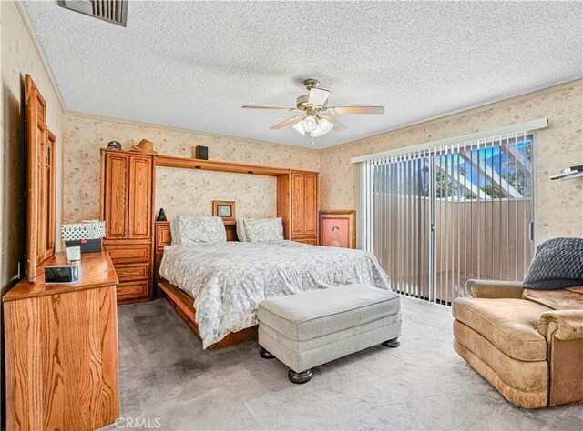 bedroom featuring carpet, a textured ceiling, access to exterior, and ceiling fan