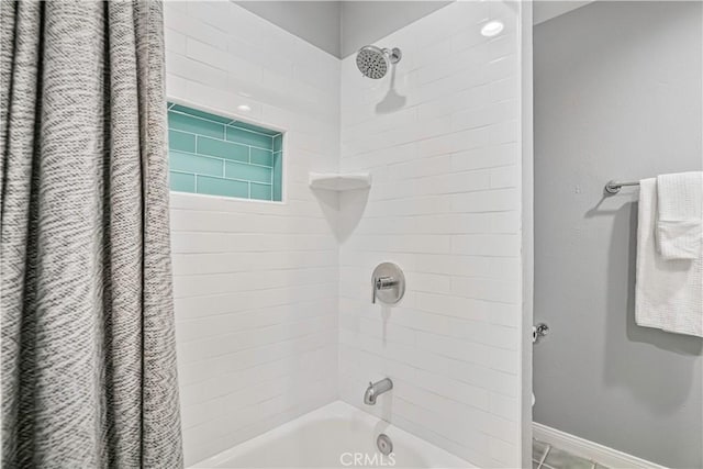 bathroom with shower / bath combo with shower curtain