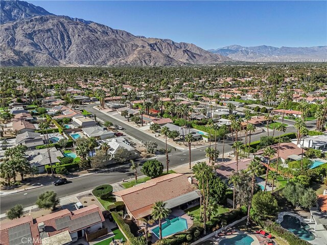 birds eye view of property with a mountain view