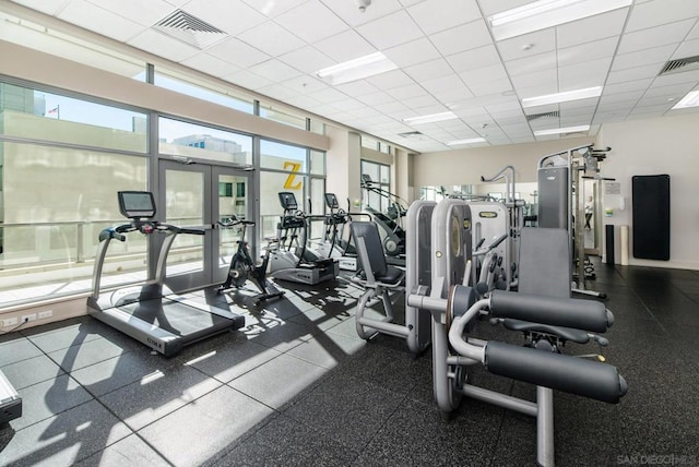 exercise room with a drop ceiling