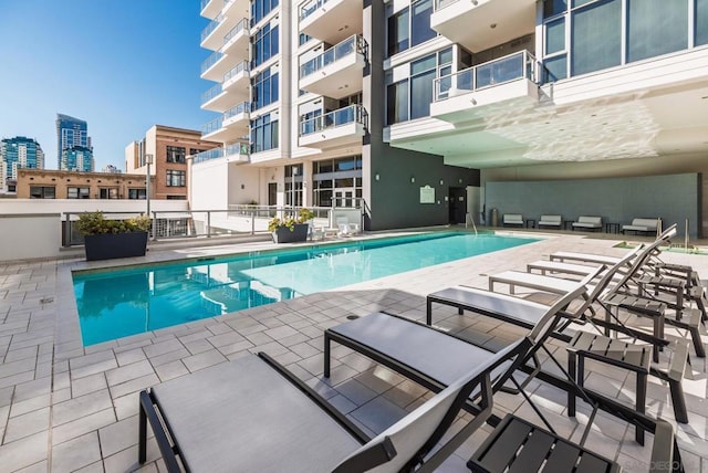 view of swimming pool with a patio area