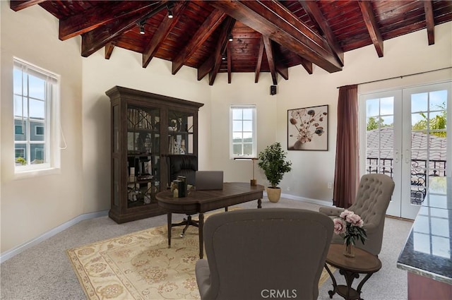 home office featuring a healthy amount of sunlight, light colored carpet, french doors, and wooden ceiling