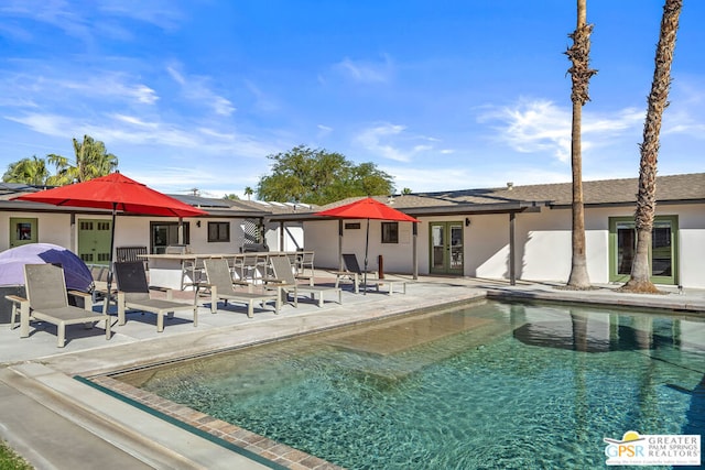 view of swimming pool with a patio