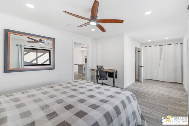 bedroom with ceiling fan and light hardwood / wood-style flooring