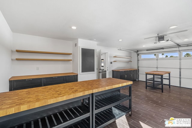 kitchen featuring butcher block countertops and dark hardwood / wood-style floors