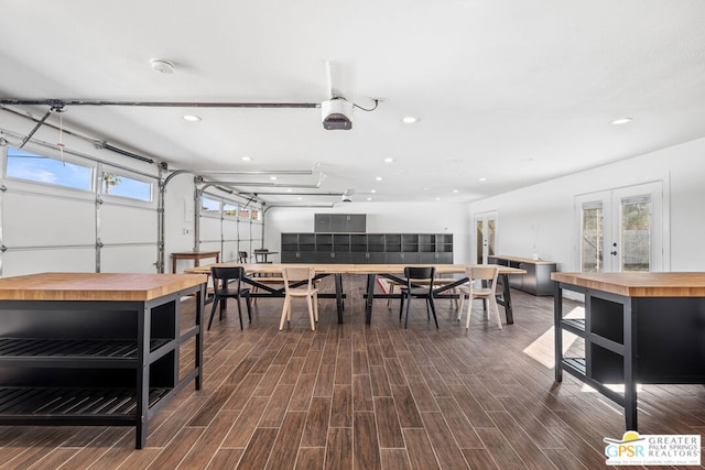 dining area with dark hardwood / wood-style flooring and french doors