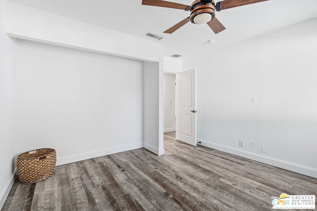 spare room with ceiling fan and wood-type flooring