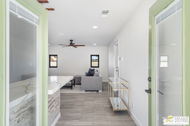 hall with light hardwood / wood-style floors