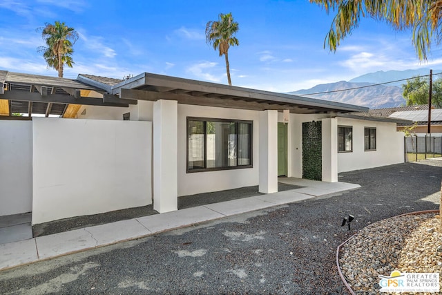 rear view of house with a mountain view