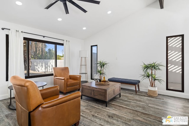 living area featuring dark hardwood / wood-style floors, ceiling fan, and lofted ceiling