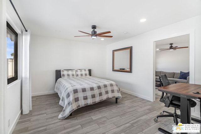 bedroom with light hardwood / wood-style flooring and ceiling fan