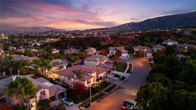 aerial view at dusk with a mountain view