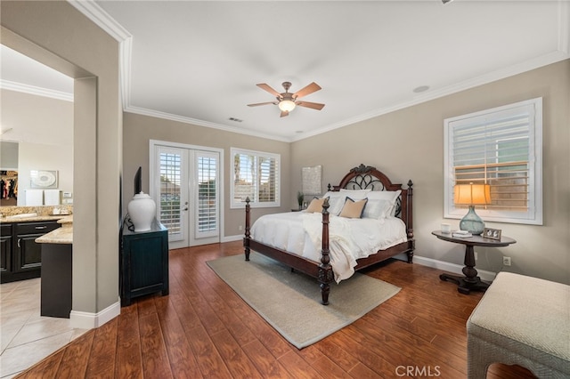 bedroom featuring access to exterior, ceiling fan, dark wood-type flooring, and ornamental molding