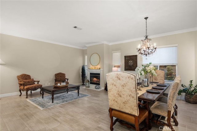 dining space featuring an inviting chandelier and crown molding