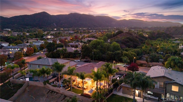 aerial view at dusk with a mountain view