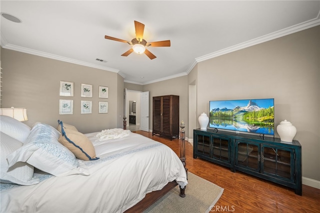 bedroom featuring ceiling fan, ornamental molding, and hardwood / wood-style flooring