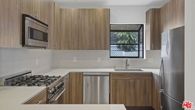 kitchen featuring stainless steel appliances and sink