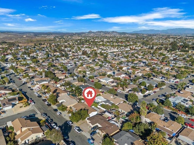 birds eye view of property featuring a mountain view