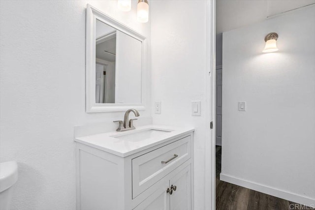 bathroom featuring hardwood / wood-style floors and vanity