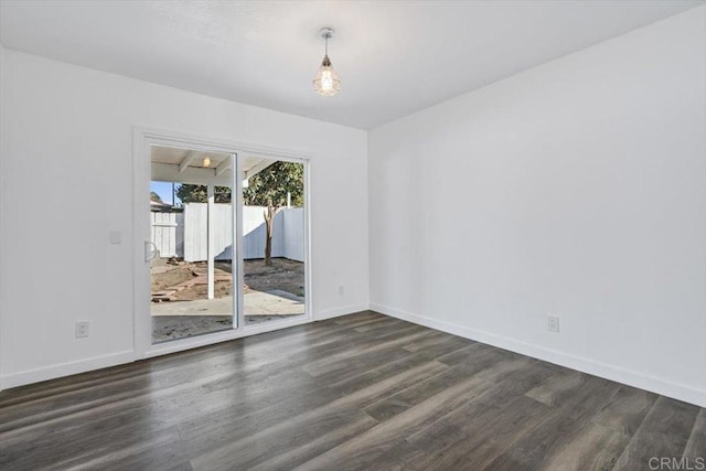 unfurnished room featuring dark hardwood / wood-style floors