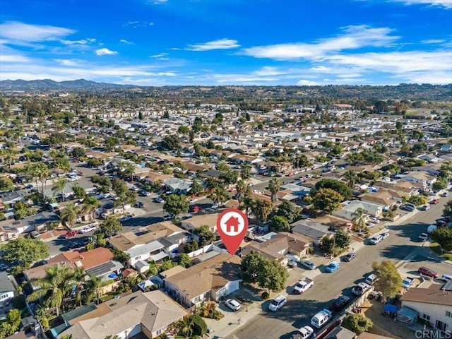 birds eye view of property featuring a mountain view