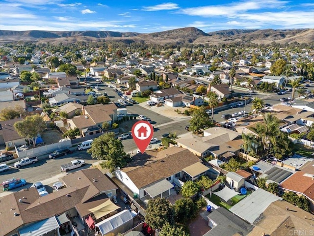 birds eye view of property with a mountain view