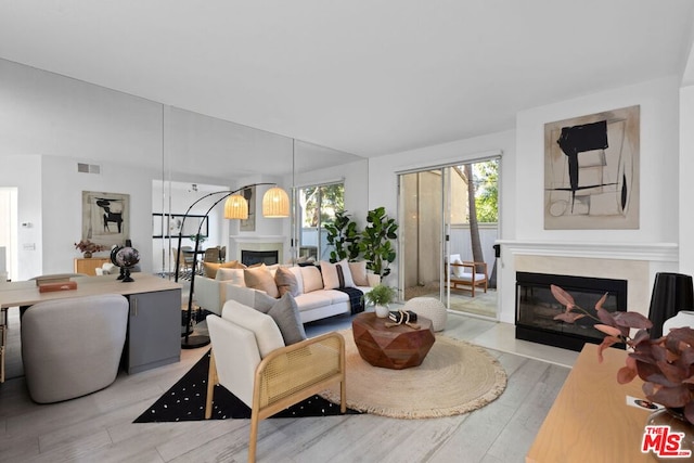 living room with light hardwood / wood-style floors