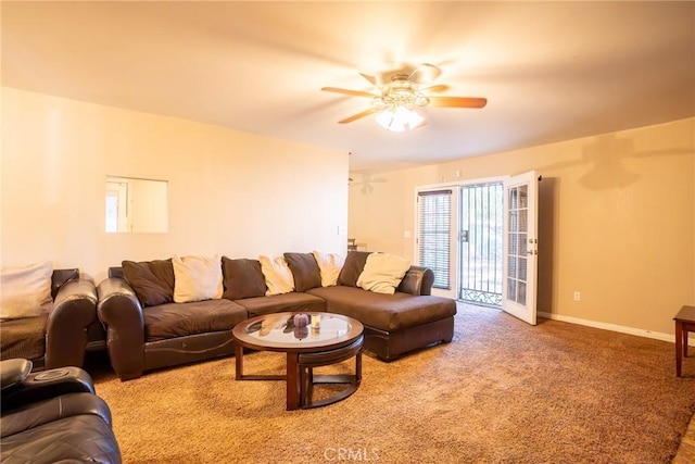 carpeted living room with ceiling fan