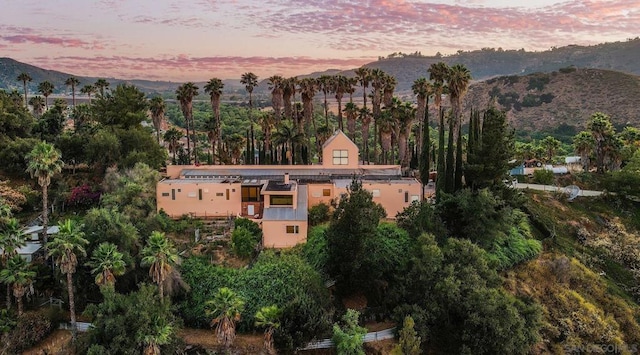 aerial view at dusk with a mountain view