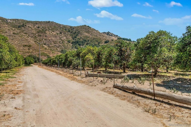 view of road featuring a mountain view and a rural view