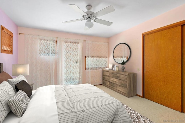 carpeted bedroom with ceiling fan