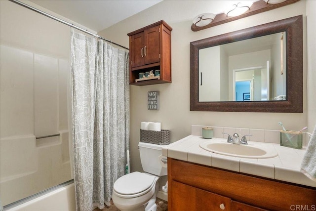 full bathroom featuring vanity, toilet, and shower / bath combo with shower curtain