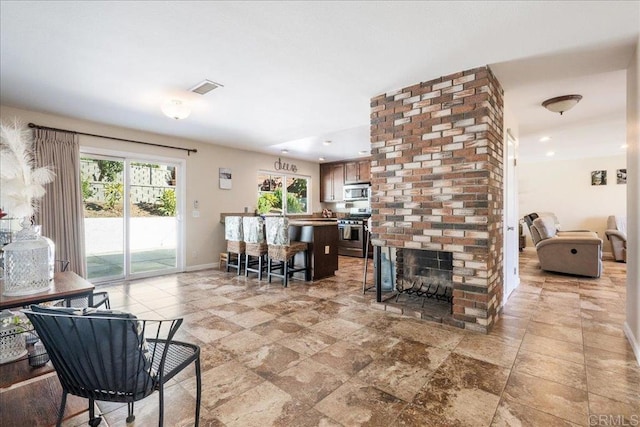 living room featuring a fireplace