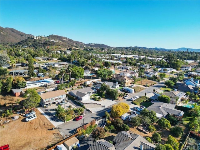 birds eye view of property featuring a mountain view