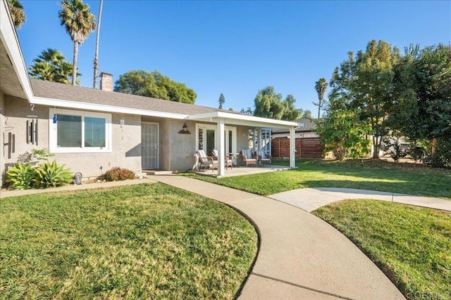 ranch-style home with a patio area and a front yard